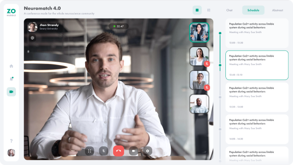 An example of ZoHuddle's video-conferencing feature, showcasing a man in business-casual attire giving a presentation to four attendees.